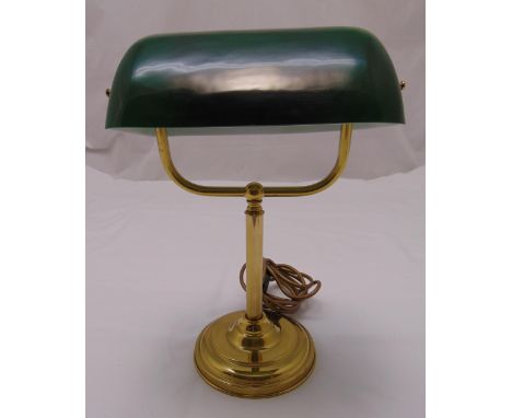 A brass desk lamp with green glass shade on raised circular base, 36.5cm (h)