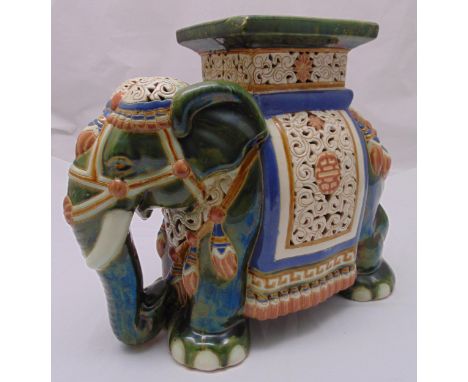 An oriental ceramic polychromatic figurine of an elephant, 43.5 x 50 x 23cm