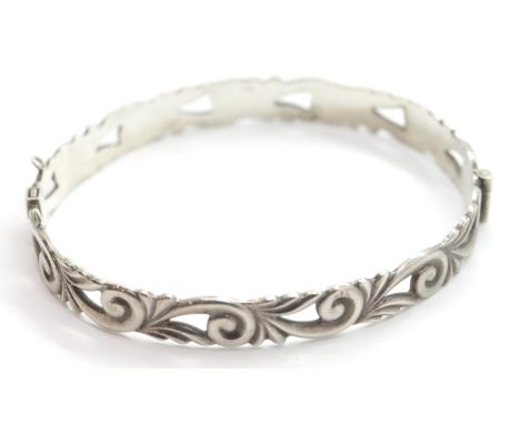 Silver 1970s scroll design hinged bangle. P&amp;P Group 1 (£14+VAT for the first lot and £1+VAT for subsequent lots) 
