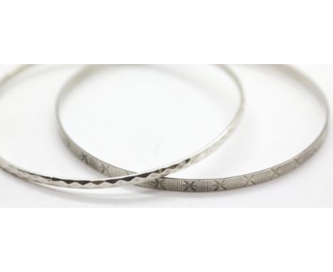 Two solid silver diamond cut slave bangles. P&amp;P Group 1 (£14+VAT for the first lot and £1+VAT for subsequent lots) 