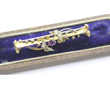 Cased 9ct gold amethyst and seed pearl brooch one pearl missing L: 42 mm 2.0g.  P&amp;P Group 1 (£14+VAT for the first lot an