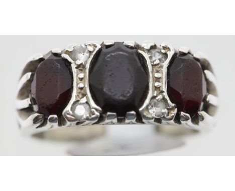 Silver vintage three stone garnet ring, size N. P&amp;P Group 1 (£14+VAT for the first lot and £1+VAT for subsequent lots) 