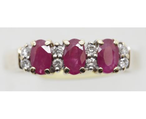 70s style three stone ruby and diamond fancy ring, size O, 3.0g. P&amp;P Group 1 (£14+VAT for the first lot and £1+VAT for su