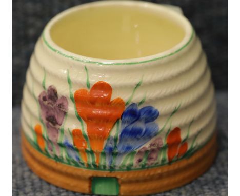 Clarice Cliff pot in the Crocus pattern, D: 9 cm. P&amp;P Group 1 (£14+VAT for the first lot and £1+VAT for subsequent lots) 