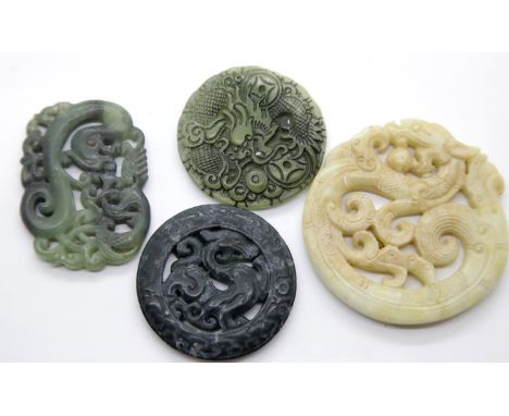 Four carved and pierced jade discs. P&amp;P Group 1 (£14+ VAT for the first lot and £2+Vat for subsequent lots) 