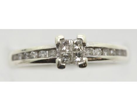 9ct white gold, four diamond set ring with channel set diamond shoulders, size P, 2.2g. P&amp;P Group 1 (£14+VAT for the firs