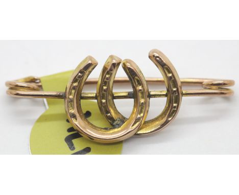 Antique 9ct rose gold double horseshoe brooch. P&amp;P Group 1 (£14+VAT for the first lot and £1+VAT for subsequent lots) 