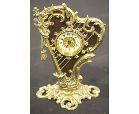 Mechanical clock in the form of a brass harp, H: 23 cm. P&amp;P Group 2 (£18+VAT for the first lot and £2+VAT for subsequent 