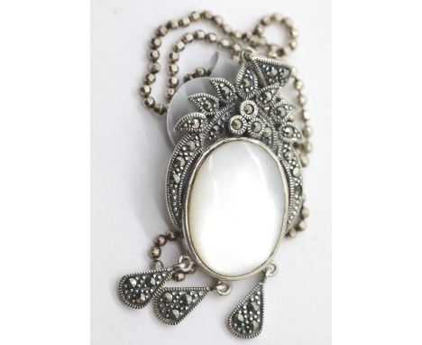 Vintage mother of pearl and marcasite pendant on 16" coriana chain. P&amp;P Group 1 (£14+VAT for the first lot and £1+VAT for