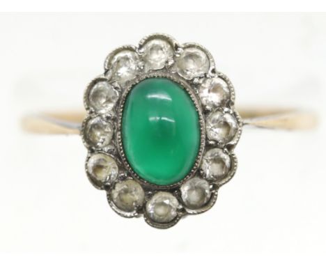 Yellow gold (marks rubbed) ring set with green cabochon surrounded by white stones, size P, 2.3g. P&amp;P Group 1 (£14+VAT fo