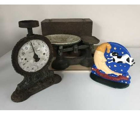 A tray of wooden box, two sets of weighing scales, metal door stop 