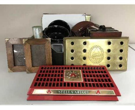 A box of metal advertising signs, school style clock, pub drips trays etc 