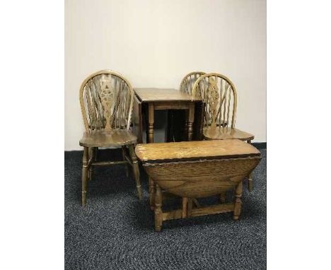 An oak gate leg table, four chairs and an oak coffee table 