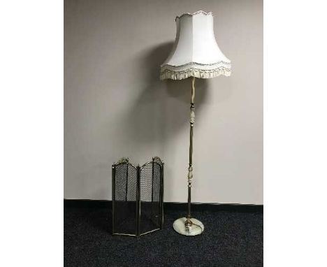 A four way brass folding spark guard and a brass & marble standard lamp 
