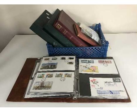 A box and one album of first day covers and stamps 