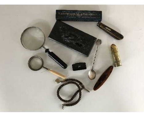 A bag of magnifying glasses, silver spoon, knife, tobacco jar, Watermans fountain pen, marble paperweights, rope fob etc 
