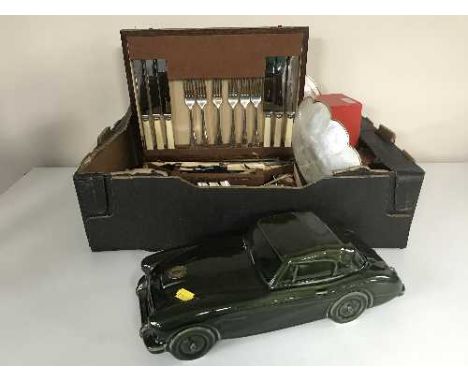 A box of oak canteen of cutlery, Dartmouth pottery china car, place mats, napkin rings, carriage clock etc 