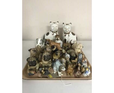 A tray of china figures, dogs, Wade whimsies, pair of Staffordshire cats 