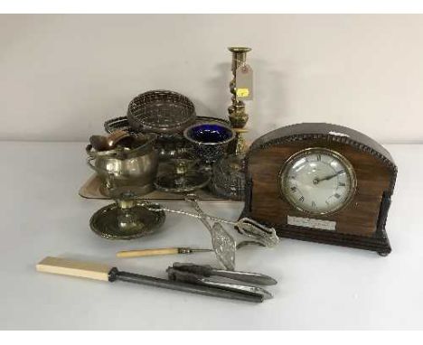 A tray of early 20th century eight day mantel clock, brass candlesticks, cutlery, plated swing handled basket etc 
