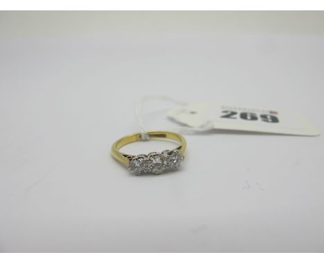 A Three Stone Diamond Ring, claw set with graduated stones, stamped "18ct &amp; Plat" (finger size K) (2.2grams). 