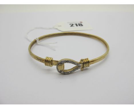 A Modern 9ct Gold Bangle, with inset highlights to loop and hook fastener (9grams). 