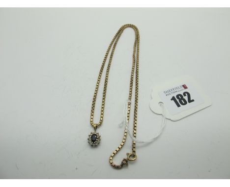 A Box Link Chain, suspending an oval cluster pendant. 