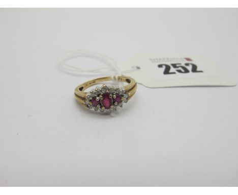 A Modern 9ct Gold Ruby and Diamond Set Dress Ring, claw set throughout (finger size O) (2.6grams).