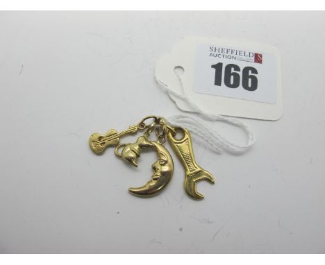 A Novelty 9ct Gold Spanner Pendant, together with three further novelty charm pendants. (4)