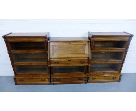 A Globe Wernicke light oak three part bookcase, 125 x 271cm