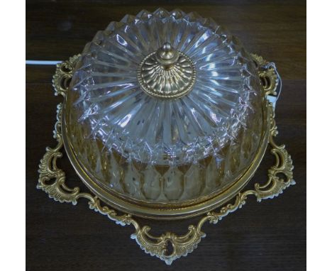 An amber glass and brass ceiling light fitting, 35cm diameter