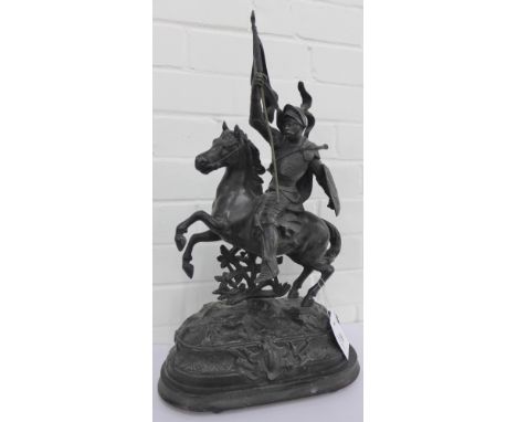 A Spelter figure of a flag bearing knight on horseback on an oval step base, 56cm high