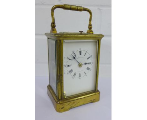 A French brass cased carriage clock, the enamel dial inscribed R. Leitzman, Paris and Cardiff, with Roman numerals and Arabic