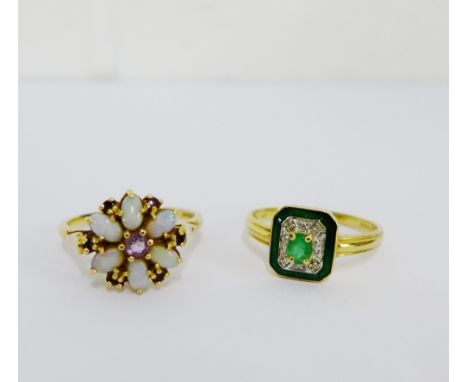 A 14 carat gold opal flowerhead dress ring and a 14 carat gold emerald, paste and enamel  dress ring (2) UK ring size T