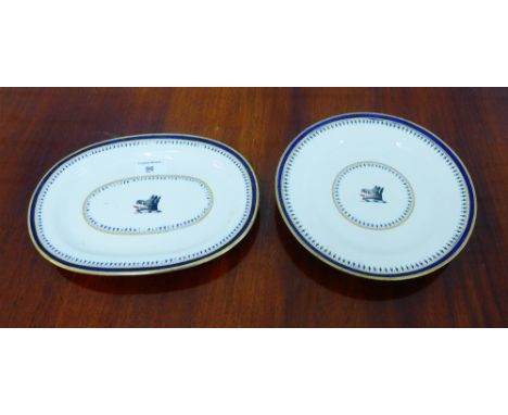 Two Chamberlains Worcester serving plates, each with a bores head crest to centre within cobalt blue and gilt edged borders, 