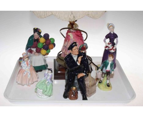 Collection of seven Royal Doulton figures and table lamp with shade.
