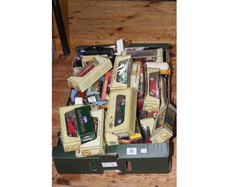 Collection of boxed model vehicles and two Goebel figures