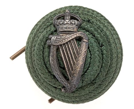 London Irish Rifles post 1901 Officer dark green cord boss bearing silvered badge.  Badge being narrow crowned Harp.    Wires