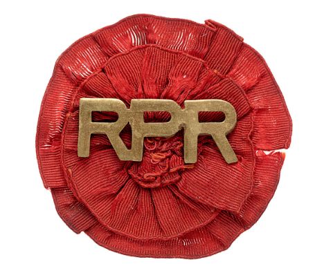 South Africa. Railway Pioneeer Regiment Boer War sheet brass slouch hat badge.  Good rare RPR letters on red silk rosette. Wi