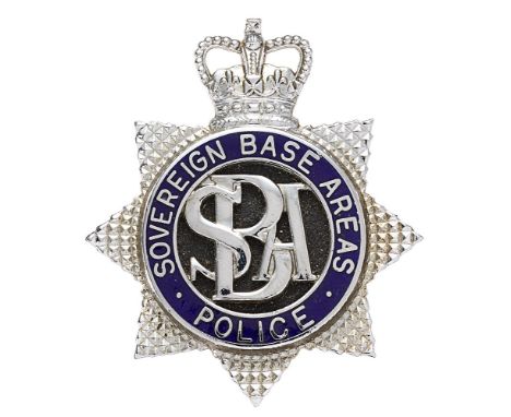 Sovereign Base Areas Police, Cyprus post 1960 cap badge.  Good scarce die-cast chromed crowned star bearing blue enamel circl