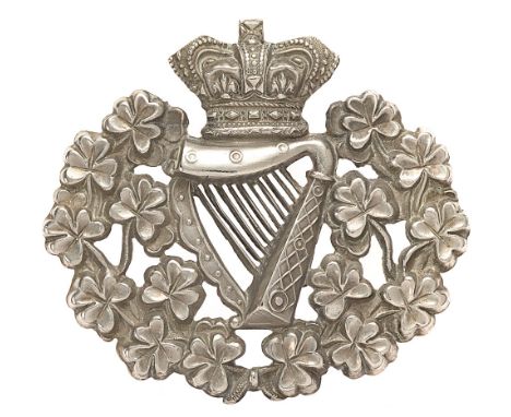Royal Irish Regiment Victorian Foreign Service helmet badge circa 1881-1901.  Good rare die-stamped white metal crowned Harp 