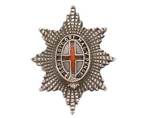 Coldstream Guards Officer Service Dress silver cap badge.  Fine small facetted silvered star mounted with pierced Garter on a