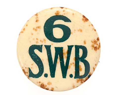 Welsh. 6th (Service) Bn. South Wales Borderers SWB early WW1 badge.  Good rare circular off white celluloid disc bearing 6 / 