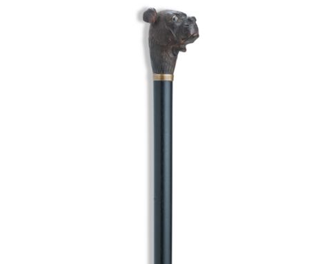 A late 19th early 20th century articulated gadget cane with carved wood Staffordshire TerrierThe head with glass eyes, automa