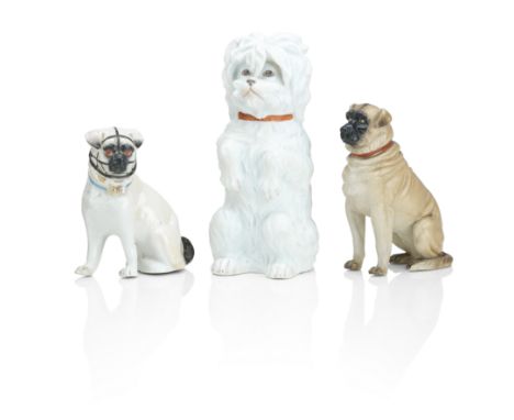 Three German porcelain dogsCirca 1900Comprising a bisque model of a seated Maltese, by Gebruder Heubach, a model of a mastiff
