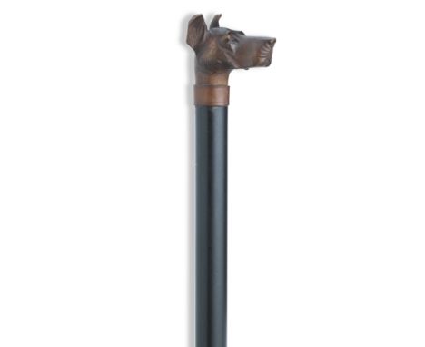 A 20th century walking cane with carved guard dog finalWith glass eyes, leather collar, ebonised hardwood shaft, light horn f