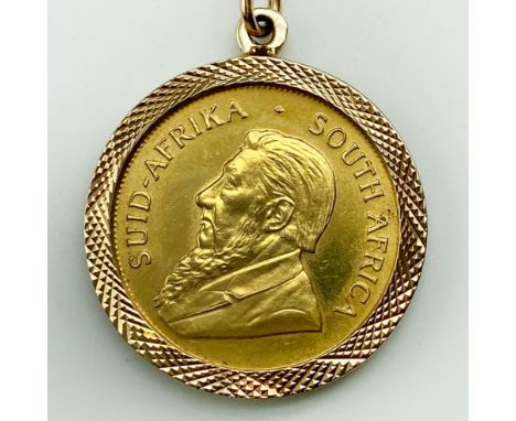FULL KRUGERRAND IN GOLD MOUNT AND 9CT GOLD CHAIN  