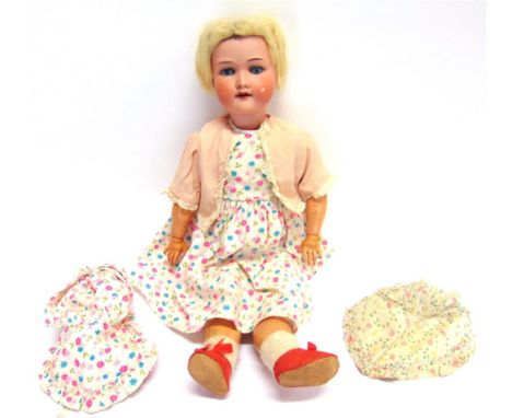 AN ARMAND MARSEILLE BISQUE SOCKET HEAD DOLL with a cropped blonde wig, sleeping blue glass eyes, and an open mouth with four 