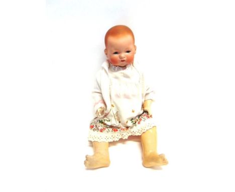 AN ARMAND MARSEILLE BISQUE FLANGE NECK DOLL with moulded and spray painted red hair, sleeping blue glass eyes, and a closed m