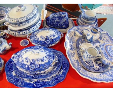 A LARGE COLLECTION OF ASSORTED BLUE AND WHITE TRANSFER PRINTED WARES,  including turkey plate and meat plates, tureens and co