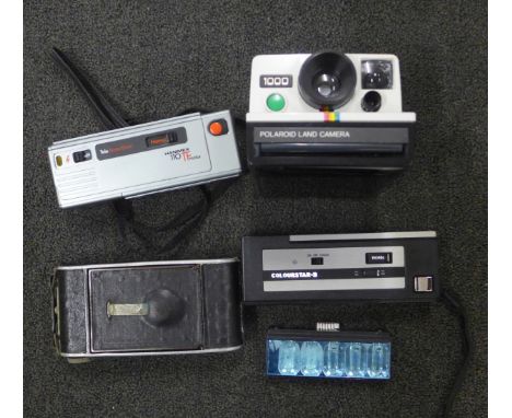 A Polaroid Land Camera 1000, a folding camera, etc. 